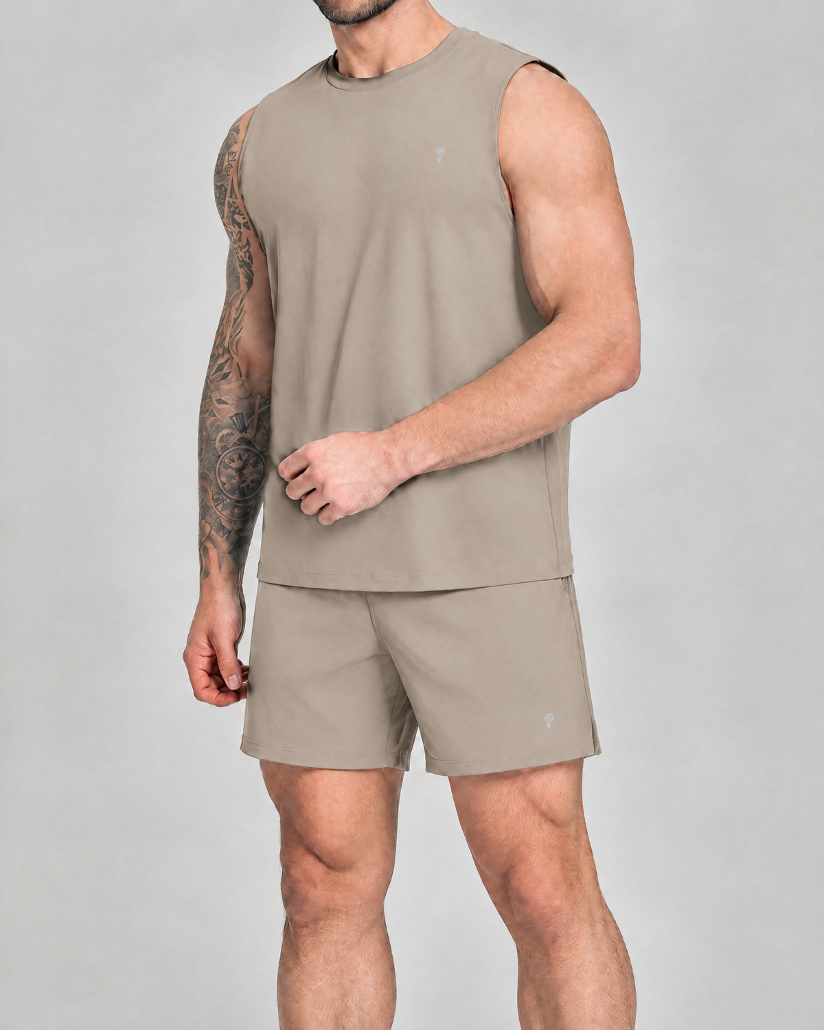 Gym Sets — Polocom Plus Court Tank & Shorts Set in Linen Khaki worn by an adult male model.