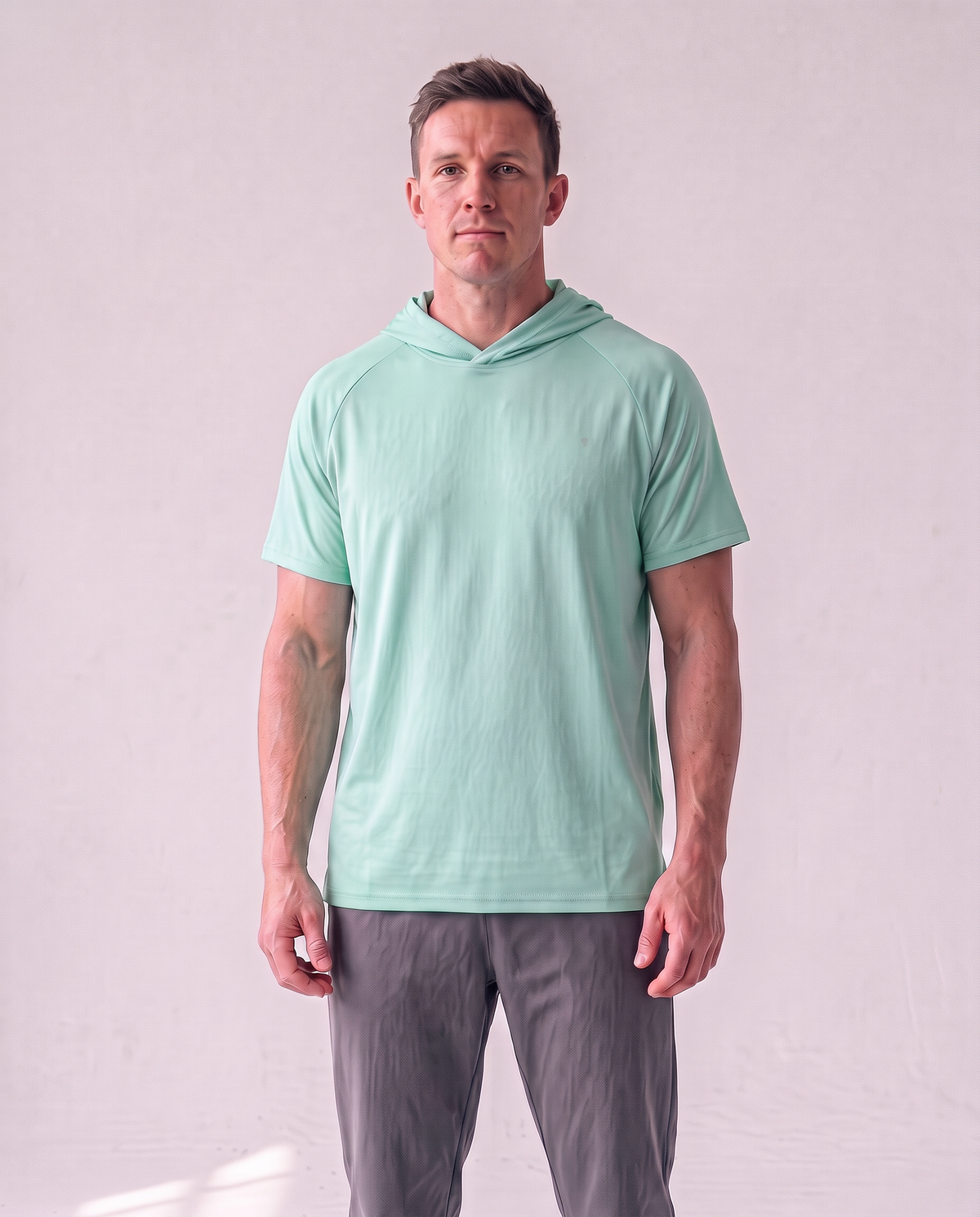 Polocom Plus Pace Short-Sleeve Hooded Tee - Light Green - worn front with small silver emblem [9031]