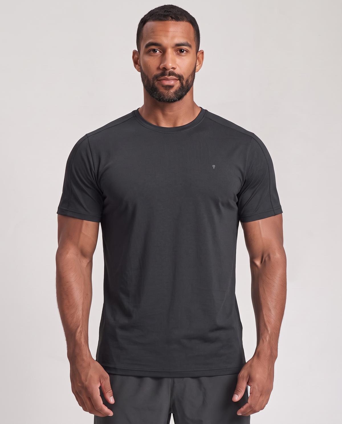 Polocom Plus Stow Sleeve-Pocket Tee - Black - worn front with small silver emblem [9046]