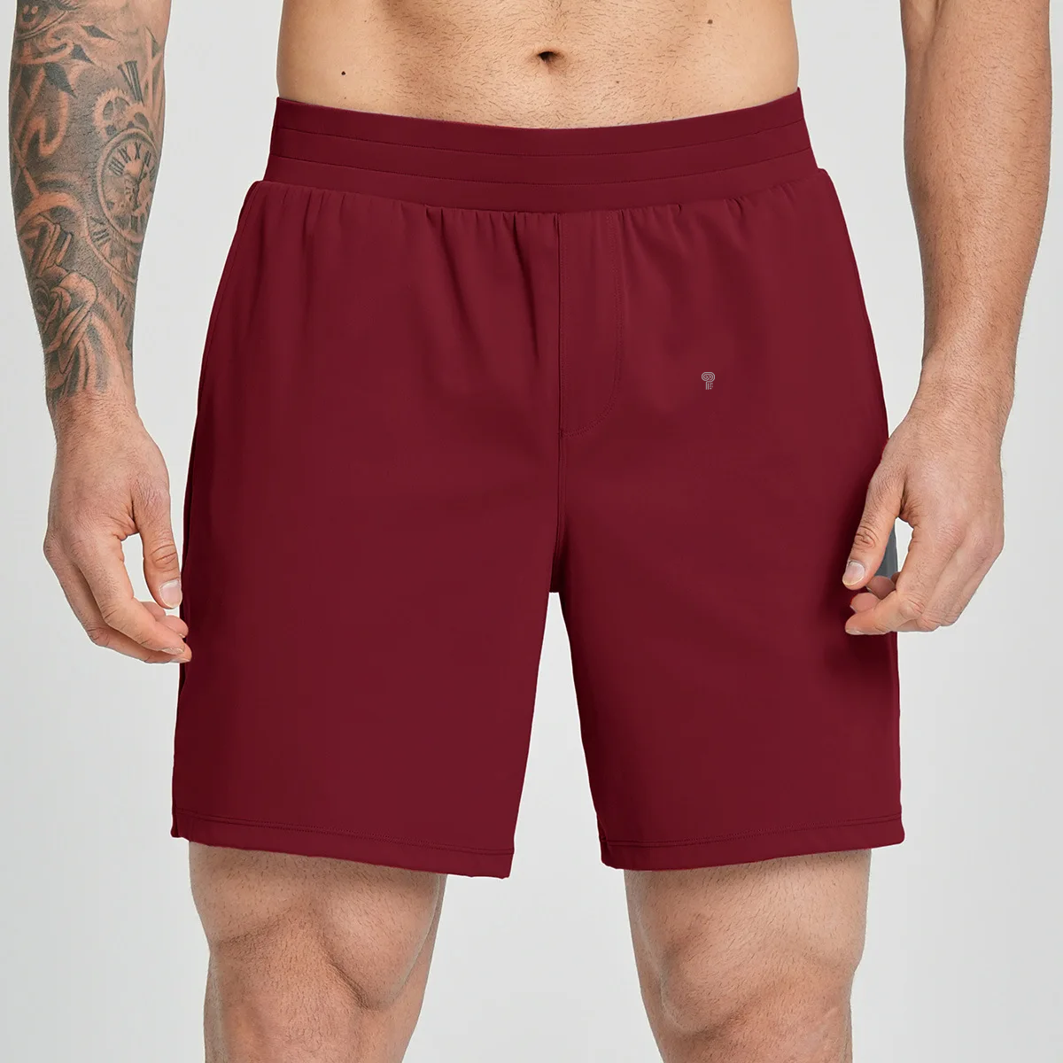 Polocom Plus Court Stretch Shorts in Red, front view worn by an adult male model