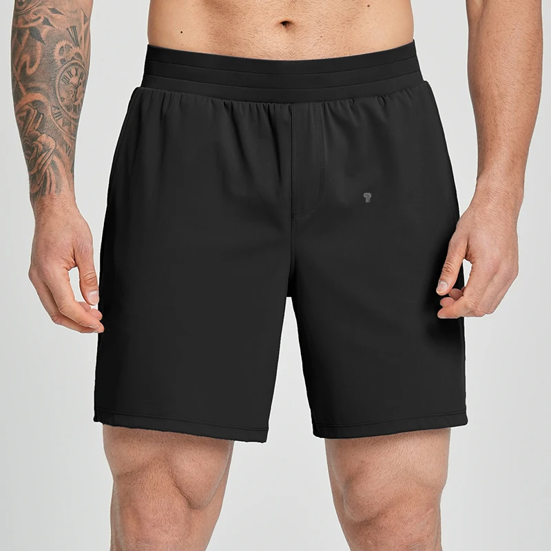 Polocom Plus Court Stretch Shorts in Black, front view worn by an adult male model