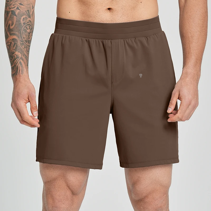 Polocom Plus Court Stretch Shorts in Brown, front view worn by an adult male model