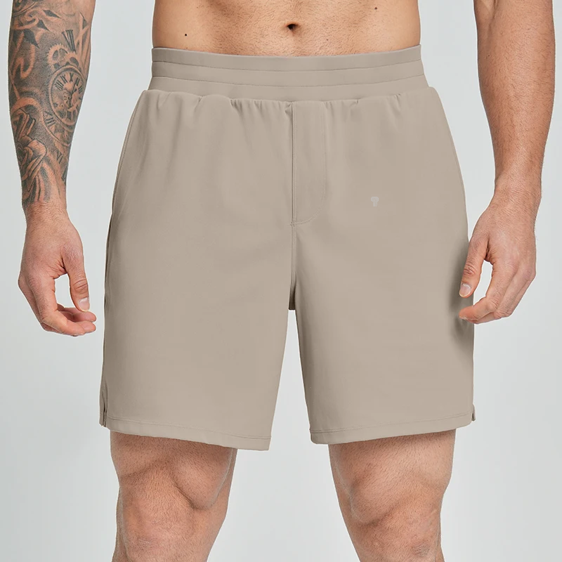 Polocom Plus Court Stretch Shorts in Khaki, front view worn by an adult male model