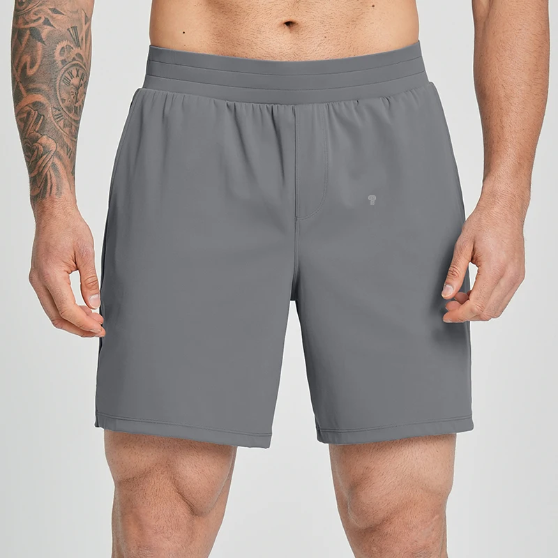 Polocom Plus Court Stretch Shorts in Gray, front view worn by an adult male model