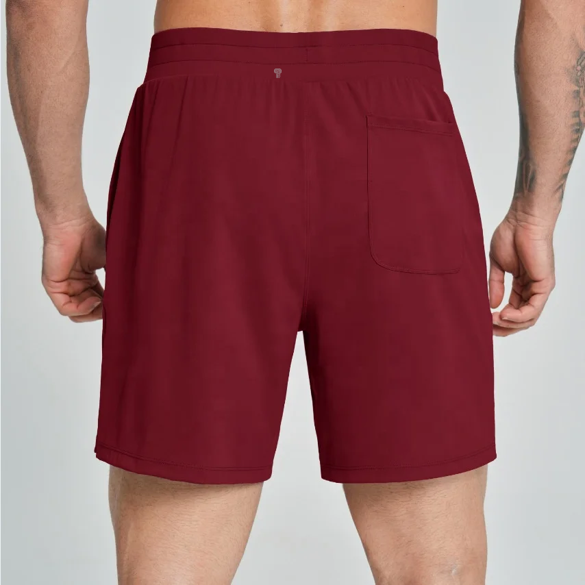 Polocom Plus Court Stretch Shorts in Red, rear view worn by an adult male model