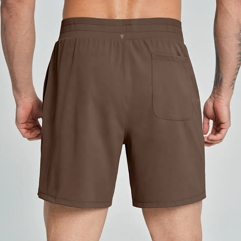 Polocom Plus Court Stretch Shorts in Brown, rear view worn by an adult male model
