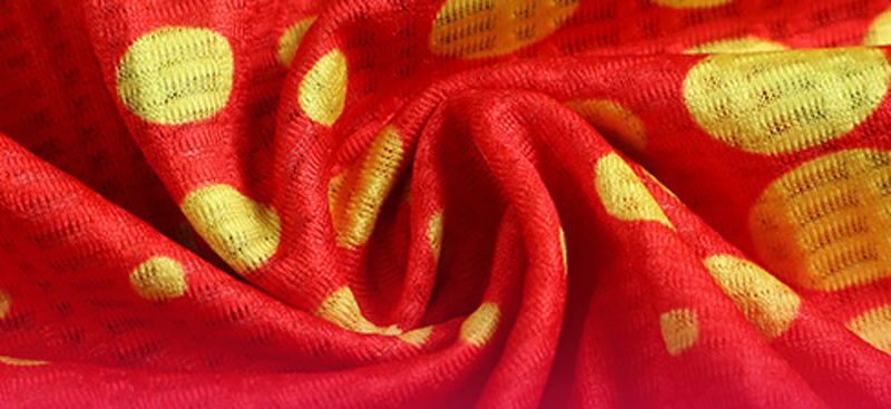 Dragon Print Running Tank fabric and dot-print close-up