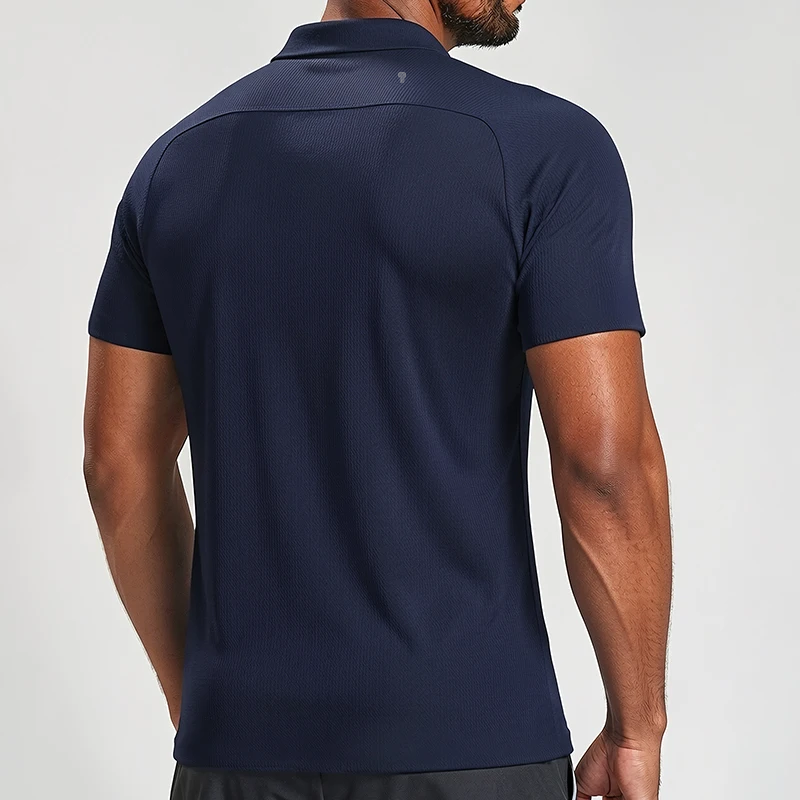 Polocom Plus Edge Stretch Golf Polo in Navy, rear view on an adult male model