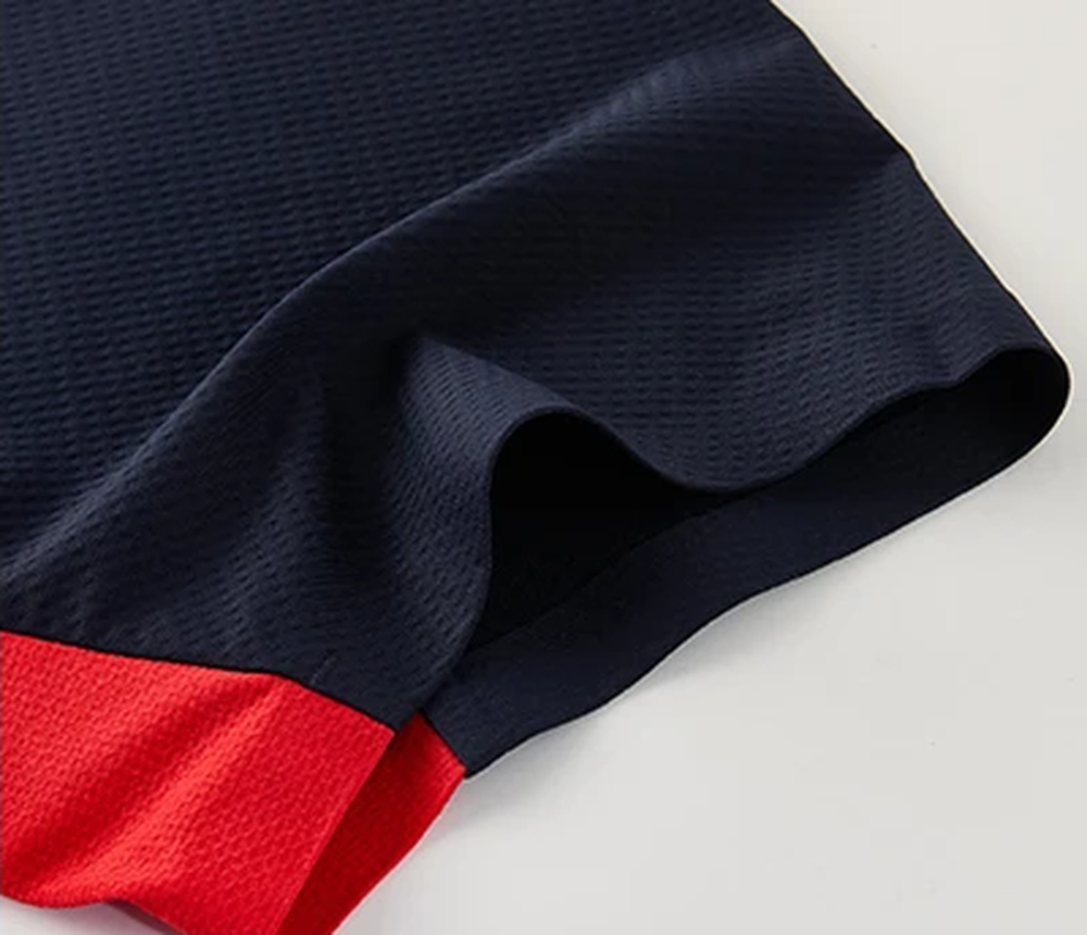 Polocom Plus Edge Stretch Golf Polo in Navy, sleeve and red side insert detail