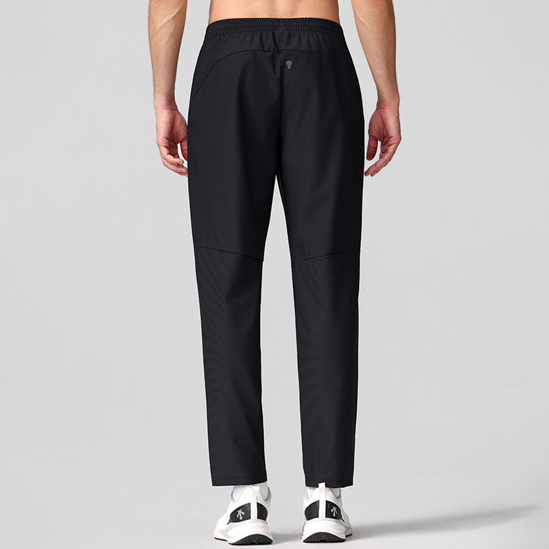 Polocom Plus Flex Straight-Leg Training Pants in Black, back view on male model