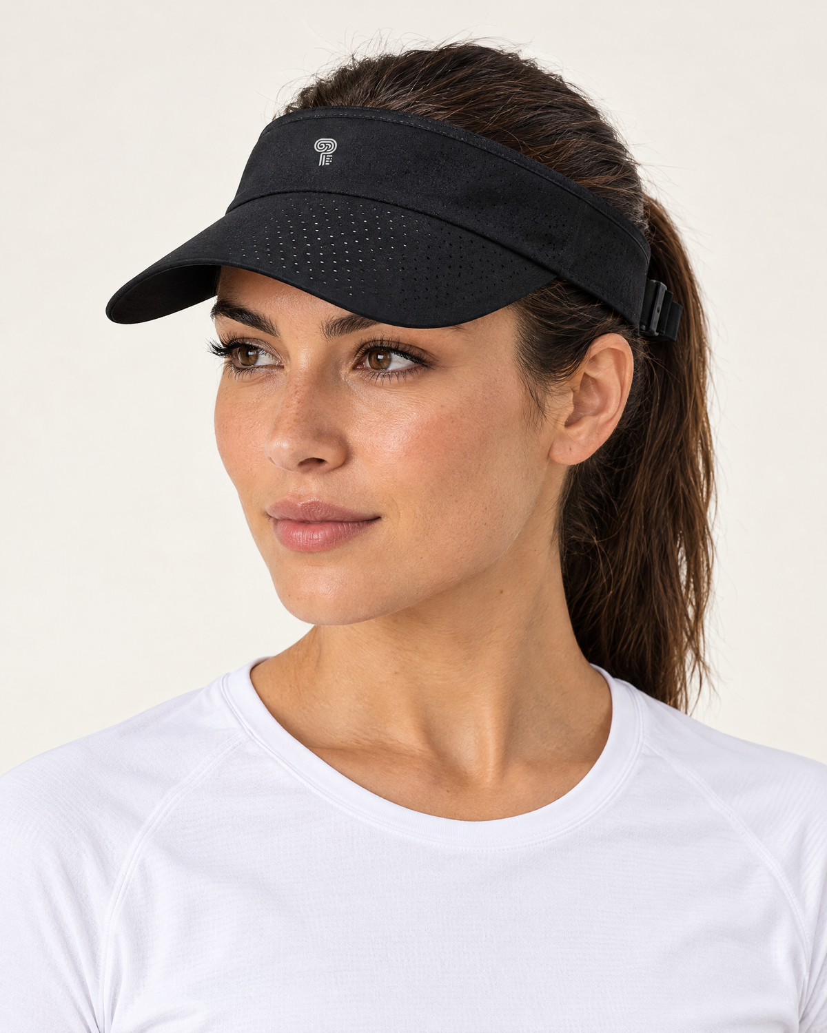 Polocom Plus Court Adjustable Sports Visor in Black, worn by an adult model with a small silver P emblem