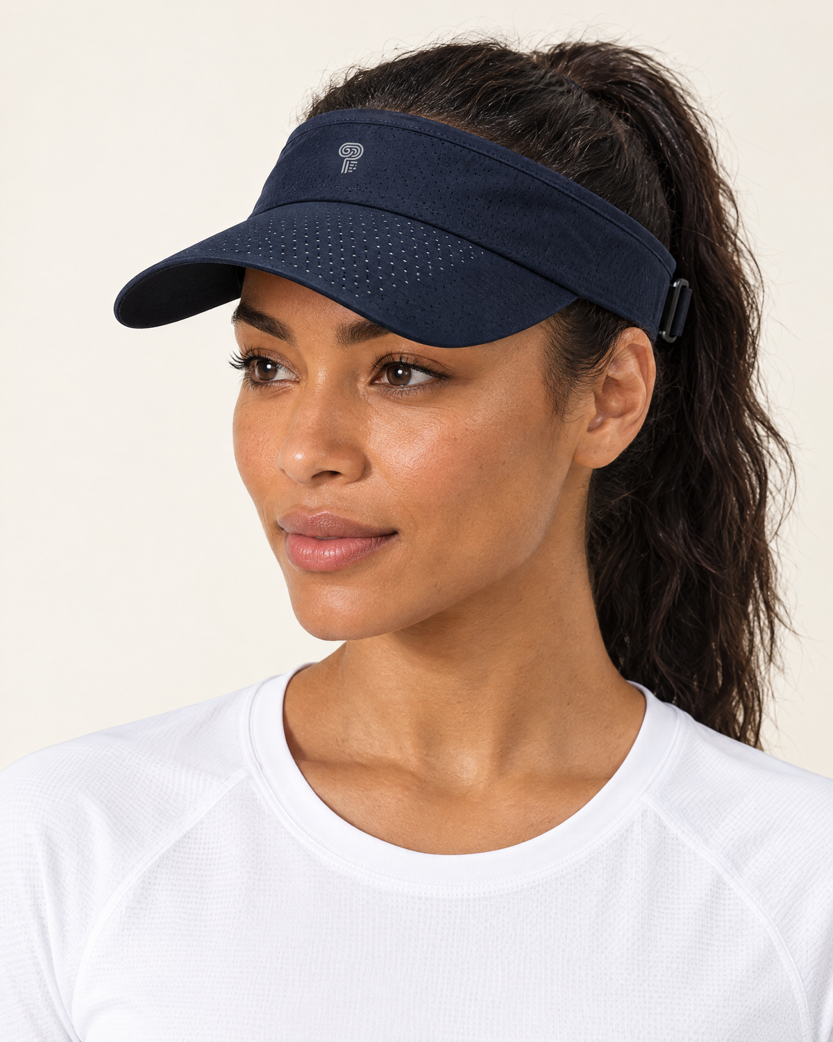 Polocom Plus Court Adjustable Sports Visor in Dark Blue, worn by an adult model with a small silver P emblem