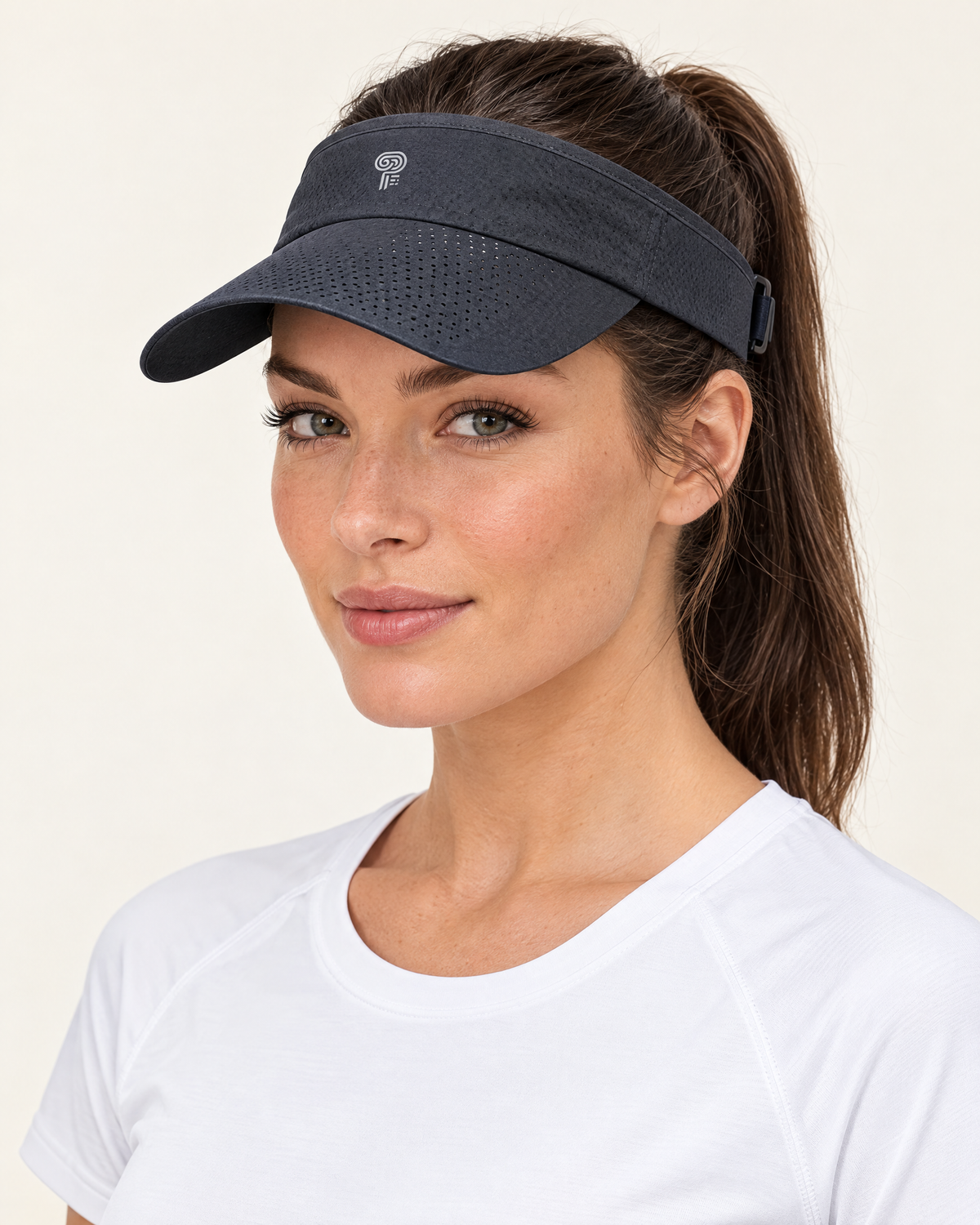 Polocom Plus Court Adjustable Sports Visor in Dark Gray, worn by an adult model with a small silver P emblem