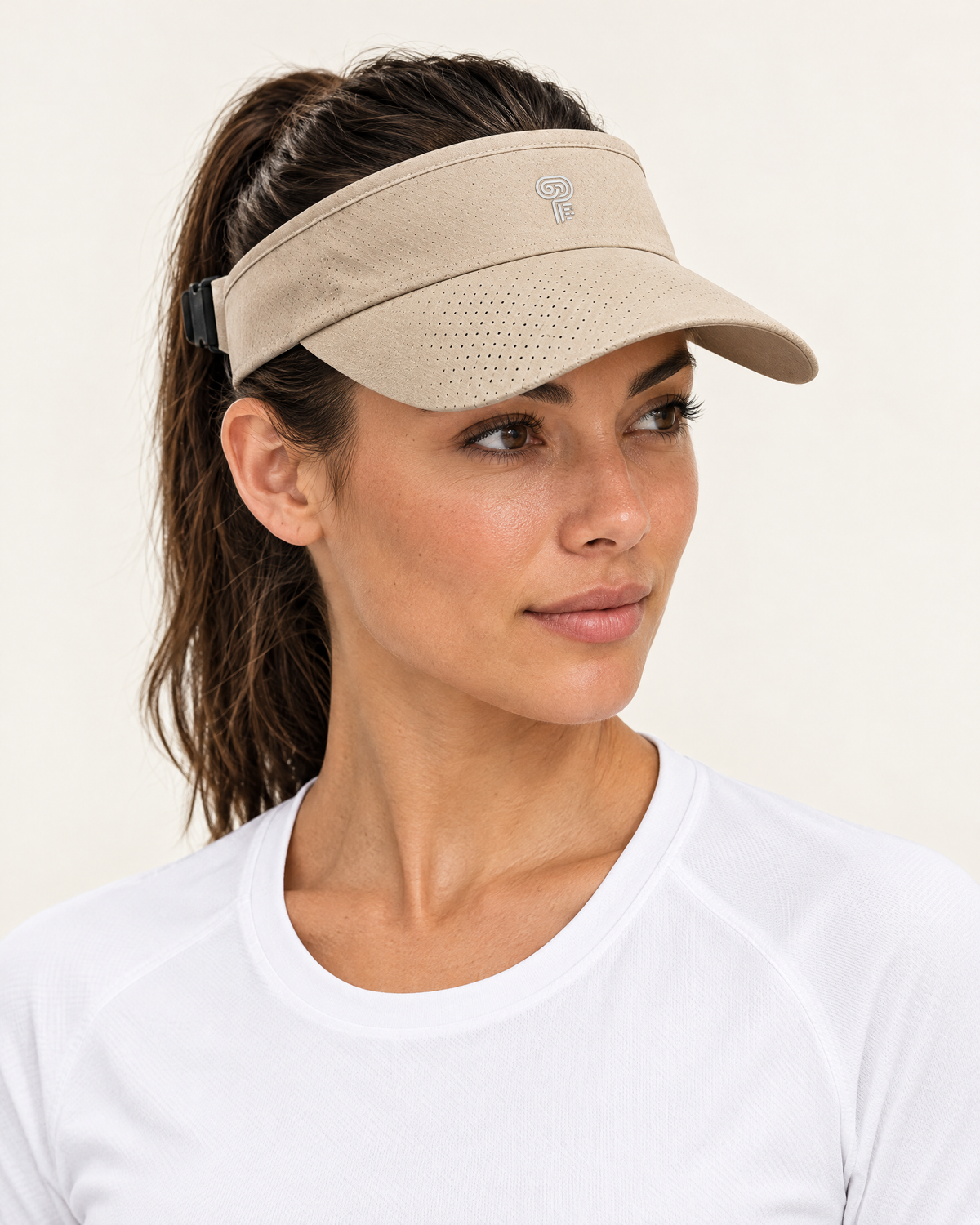 Polocom Plus Court Adjustable Sports Visor in Khaki, worn by an adult model with a small silver P emblem
