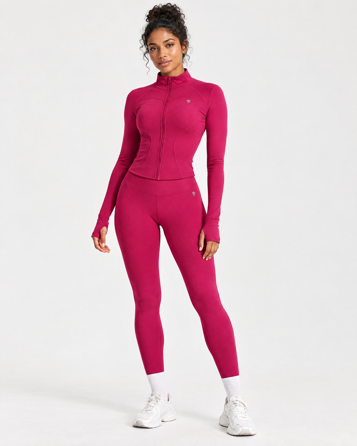 Polocom Plus Define Zip Jacket & Leggings Set in Rose Red, with a small silver P emblem, worn by an adult model