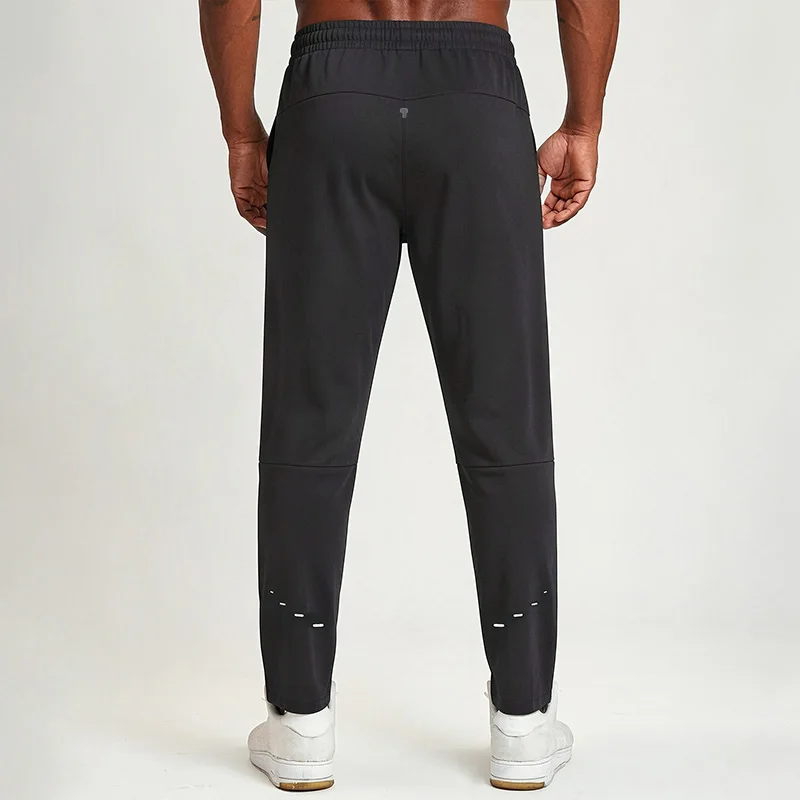 Polocom Plus Flow Drawstring Pants in Black, rear view worn by an adult male model