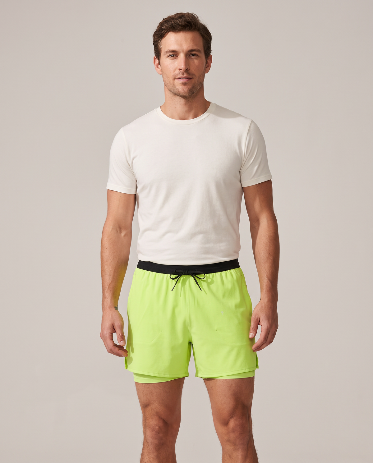Polocom Plus Velocity running shorts in green, front on model