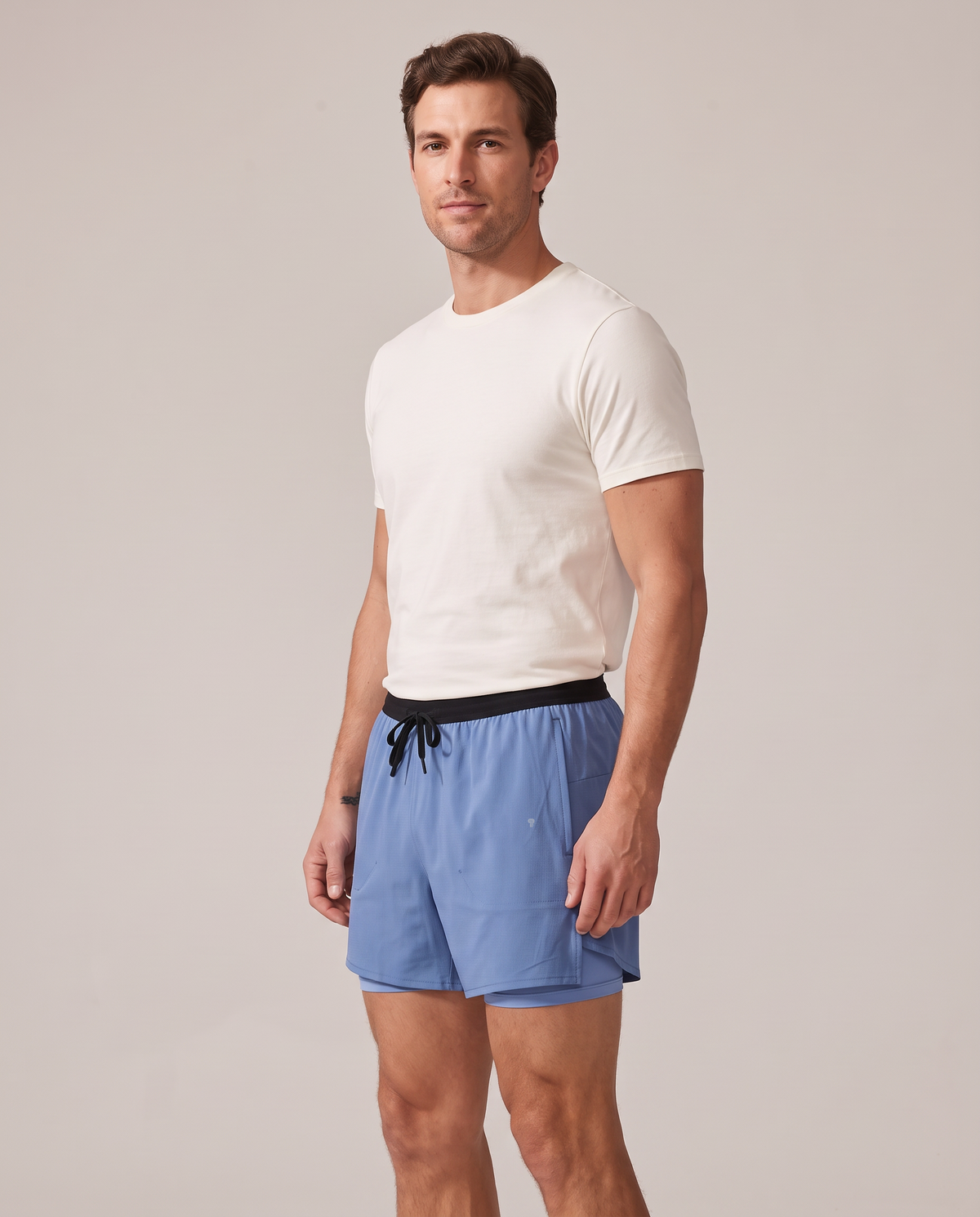 Velocity blue running shorts, side-front view showing shell overlap and short liner