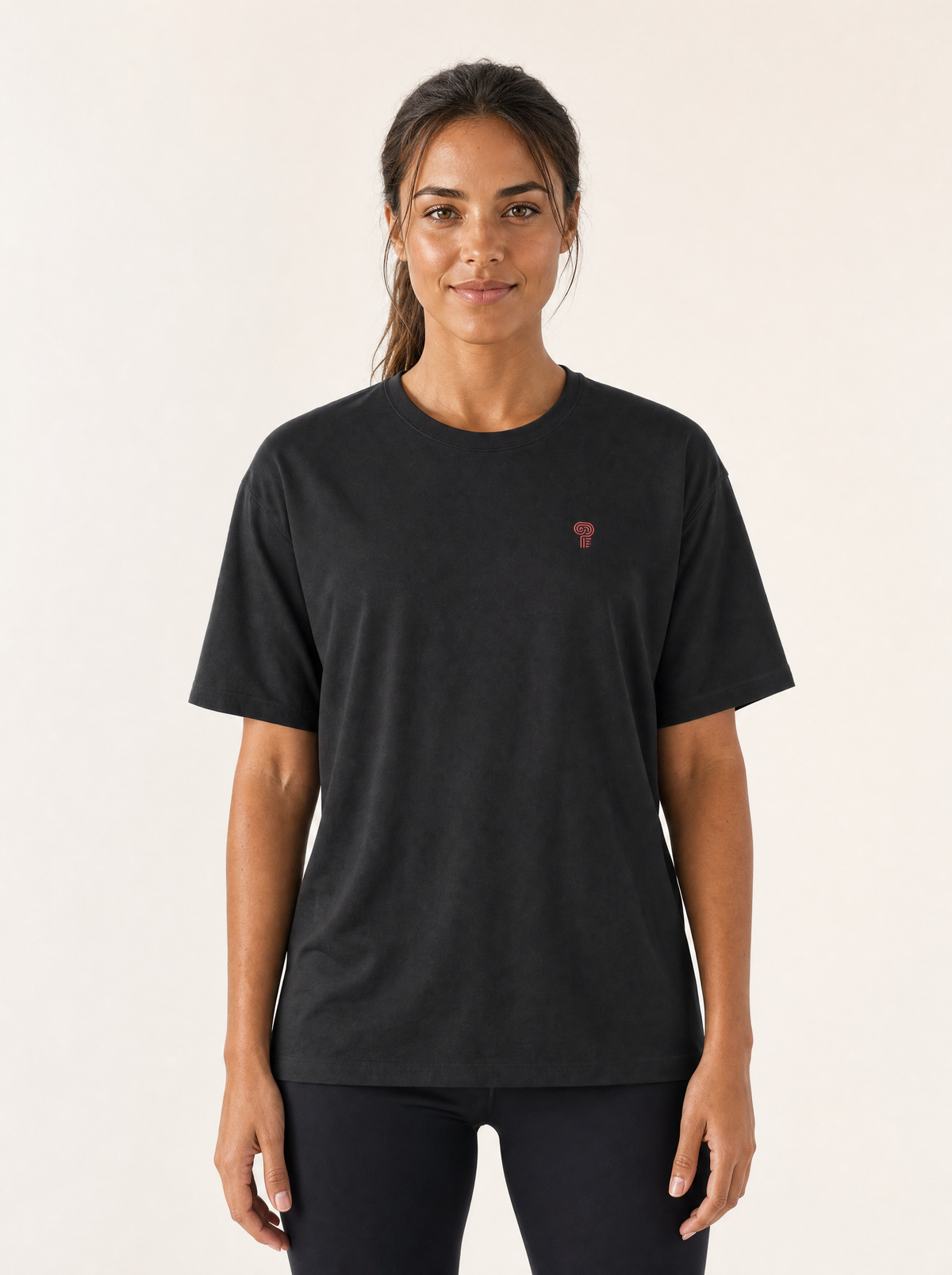 Polocom Plus Essential Tee — Black/Red shown on an adult model.