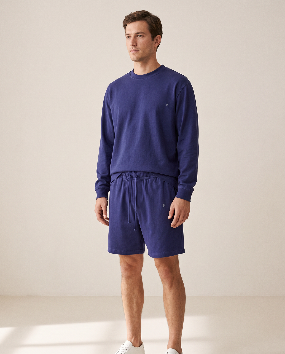 Polocom Plus Everyday Cotton Crewneck and Shorts Set in Navy on an adult male model with small silver emblems