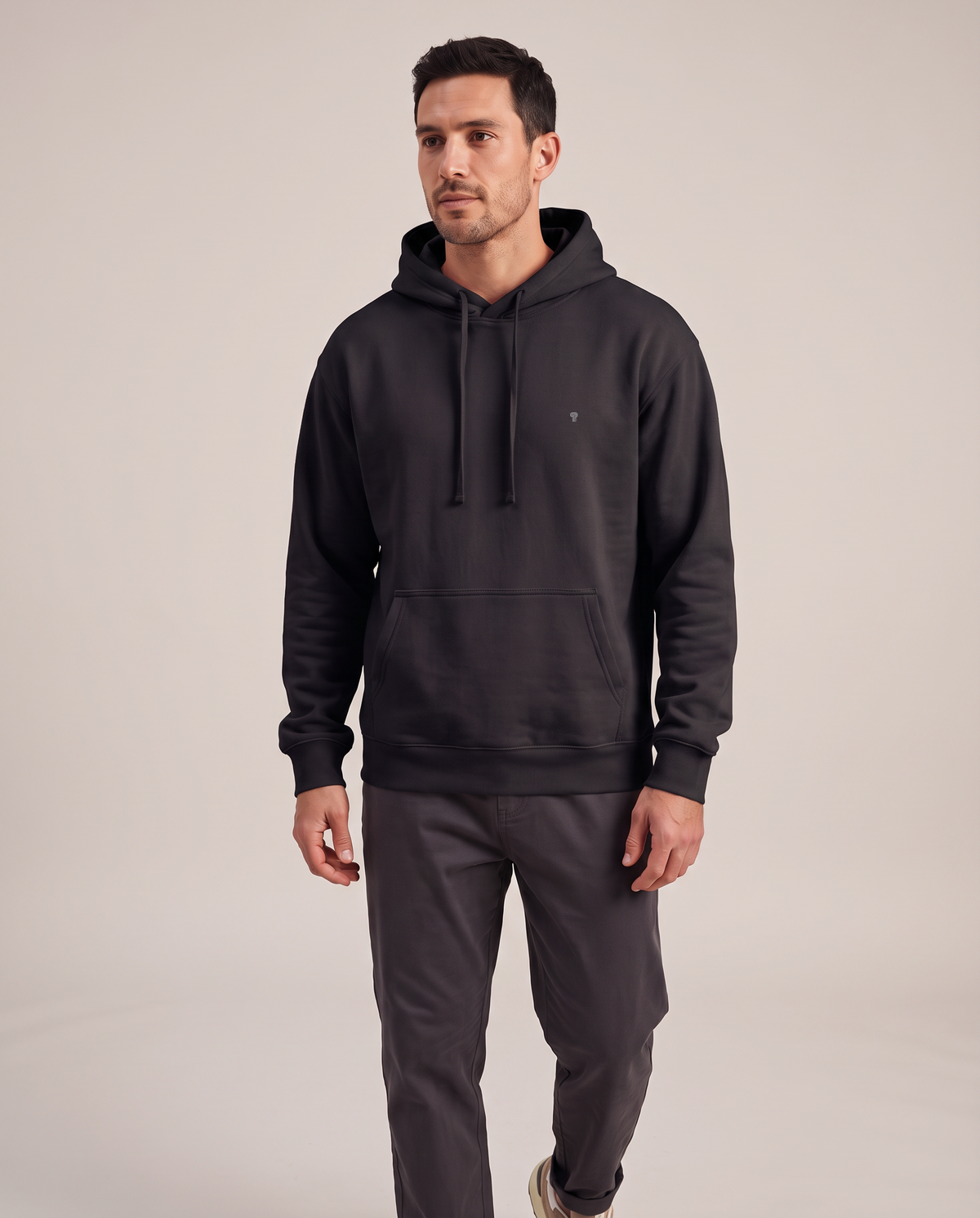 Polocom Plus Everyday hoodie in Black, front worn view with small silver emblem