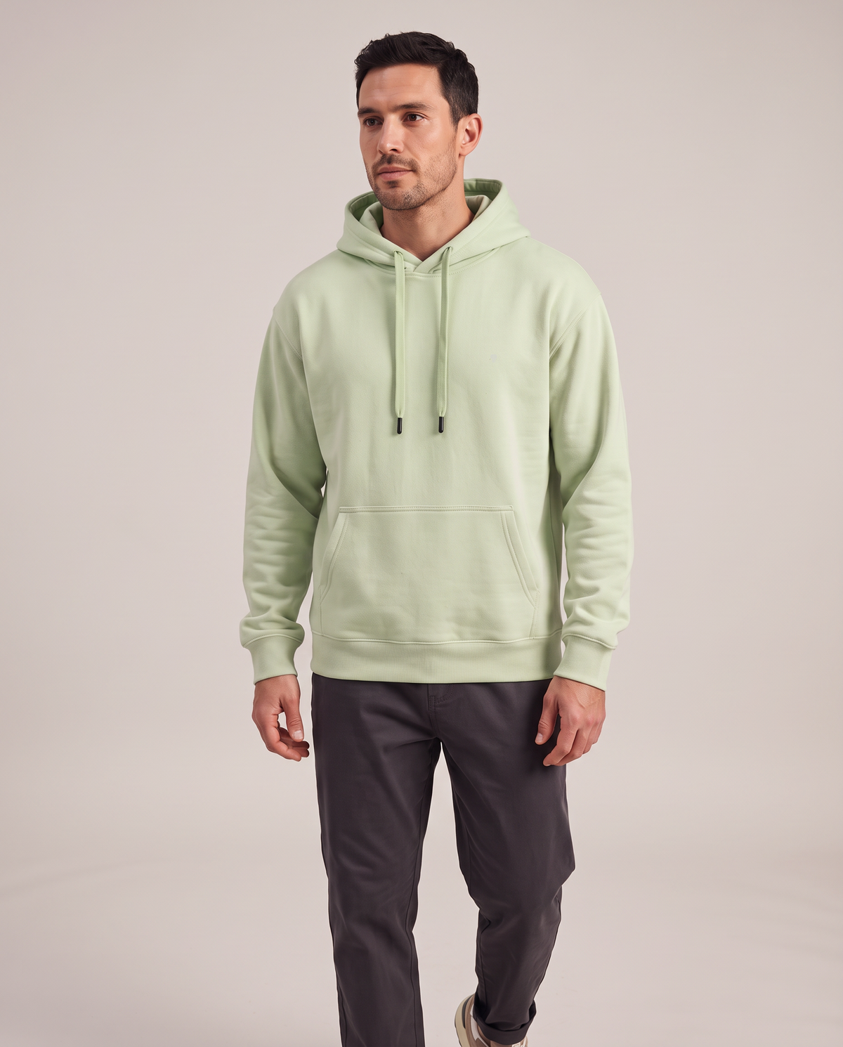 Polocom Plus Everyday hoodie in Green, front worn view with small silver emblem