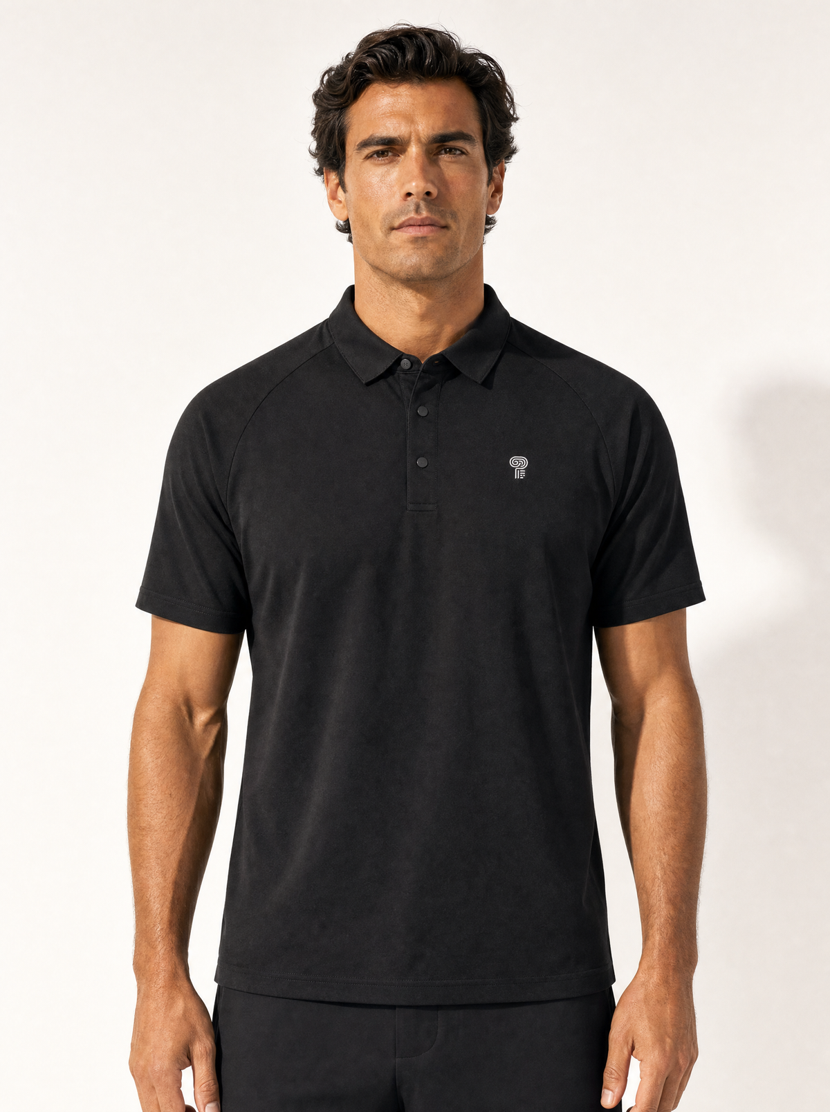 Polocom Plus Performance Polo — Black shown on an adult model.