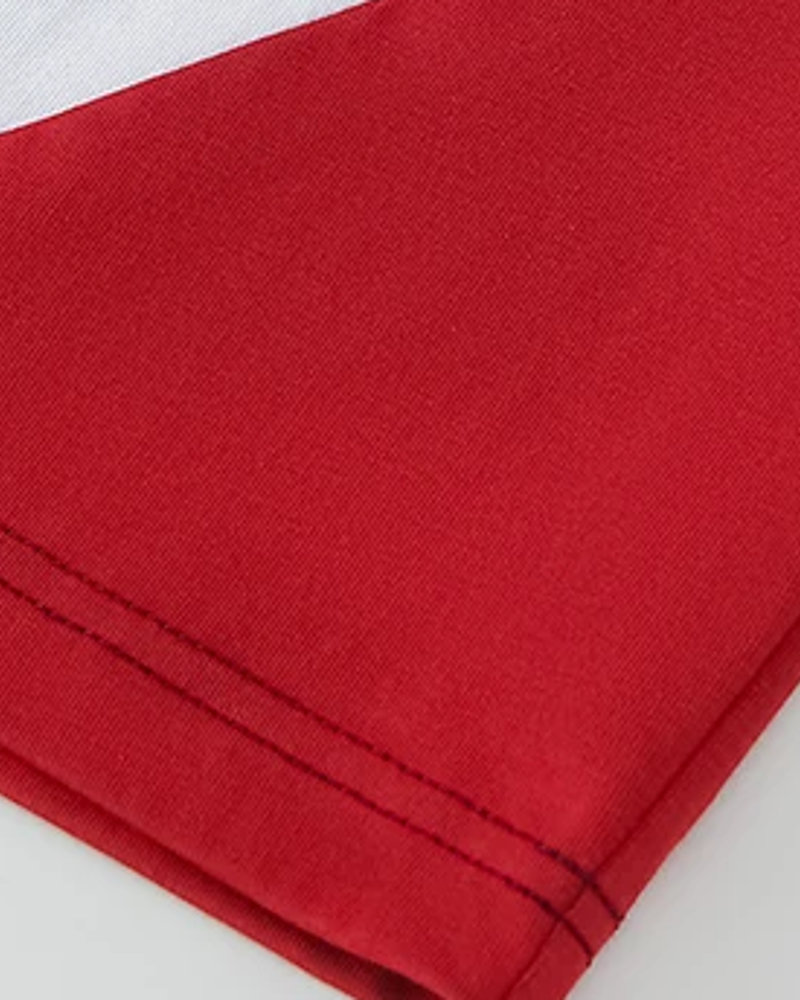 Rally tee red contrast panel and hem stitching detail