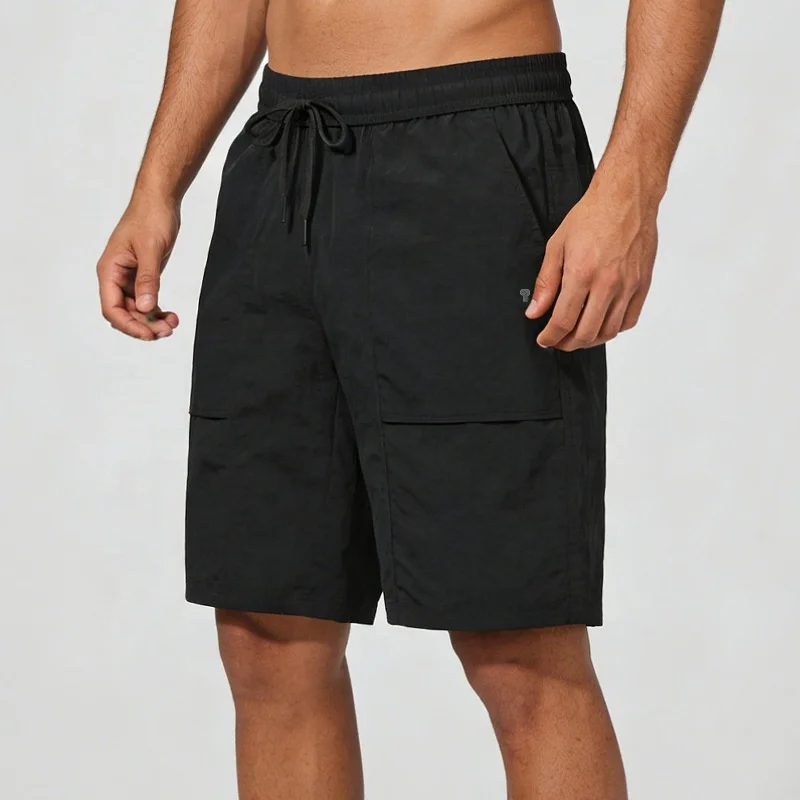 Polocom Plus Roam Nylon Shorts in Black, front view on an adult male model