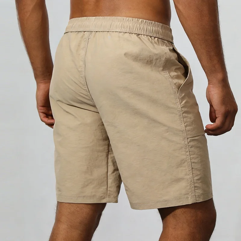 Polocom Plus Roam Nylon Shorts in Khaki, rear view on an adult male model