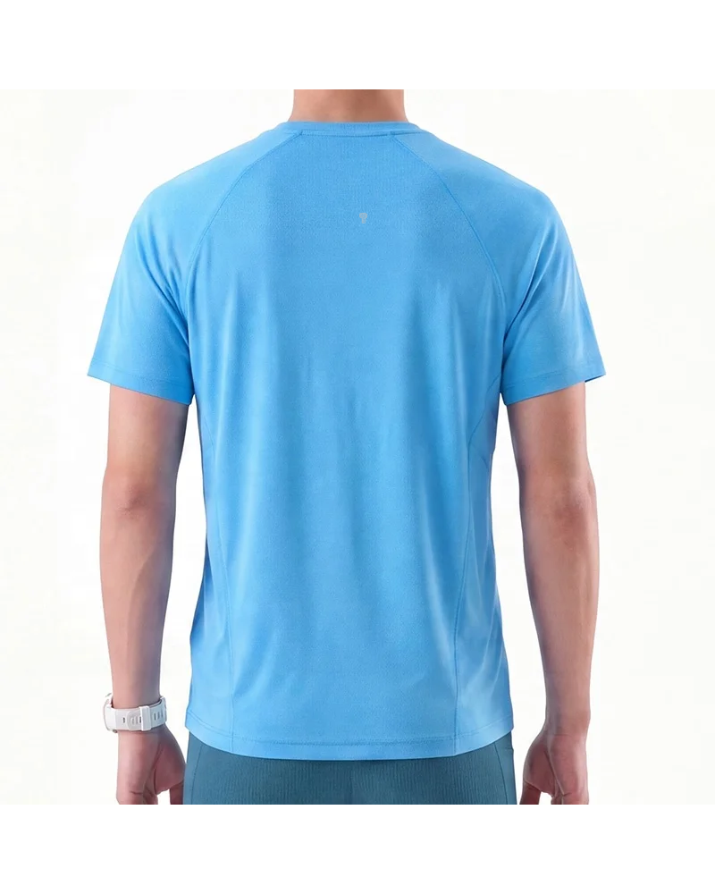 Spectrum Stretch Training Tee in Sky Blue, model rear view
