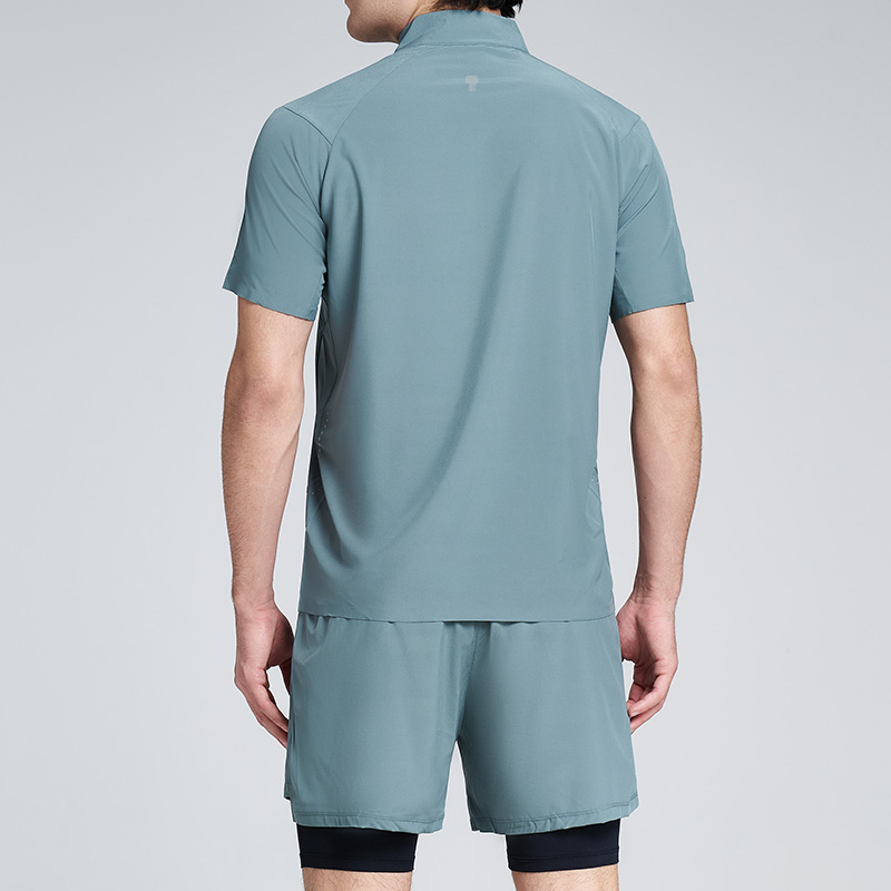Polocom Plus Stride Quarter-Zip & Lined Shorts Set in Blue Green, rear view on male model