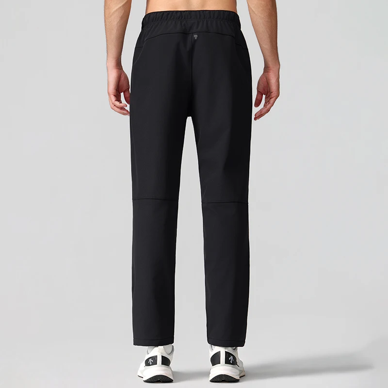 Polocom Plus Stride Straight-Leg Training Pants in Black, rear view on an adult male model